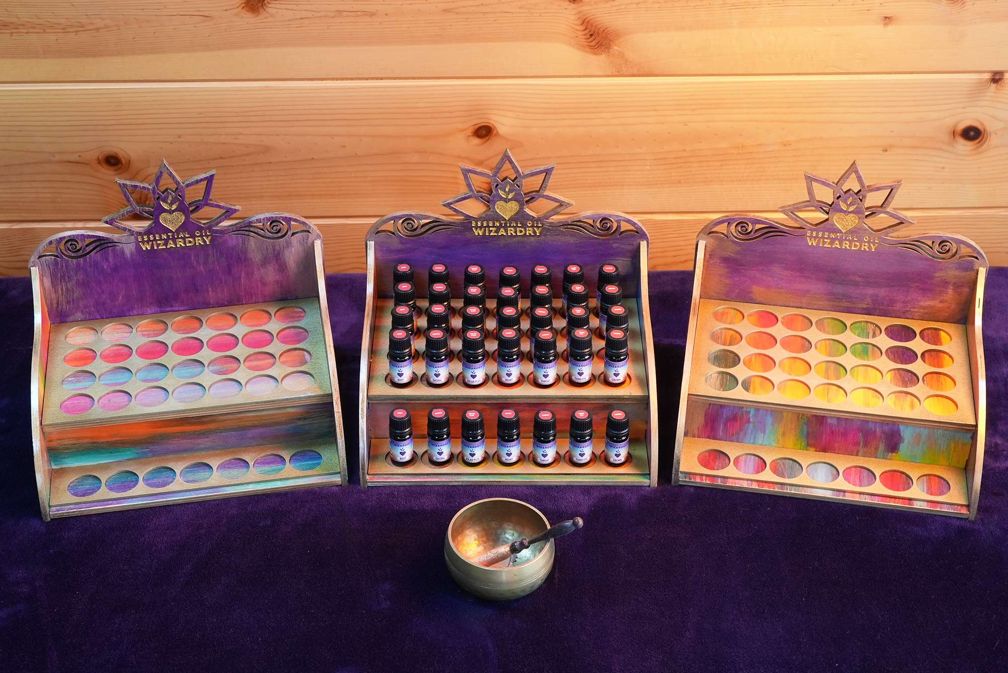 three essential oil display cases 