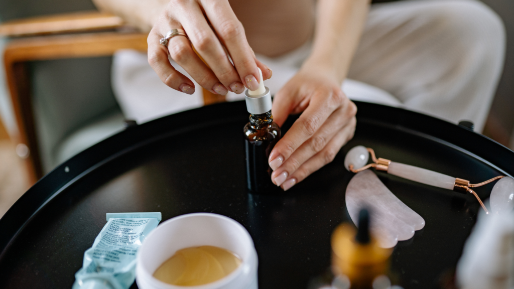 Hands Carefully Mixing Essential Oils At Home
